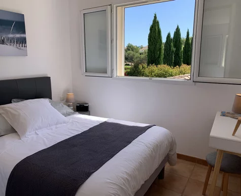 Gray bedroom upstairs, with an enchanting view of Provence